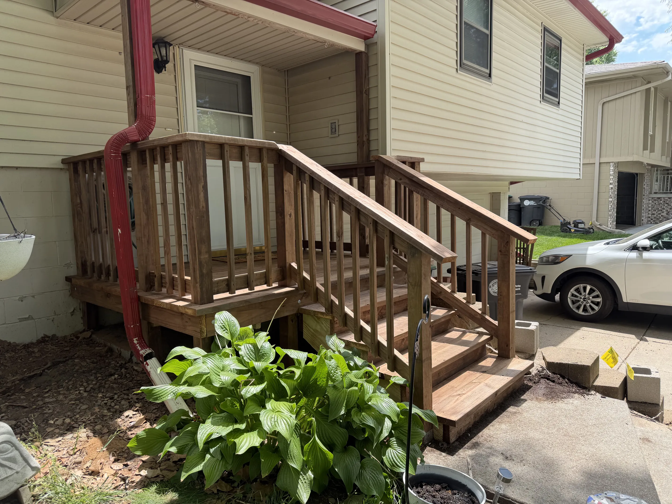 New wood porch landing with railings and steps