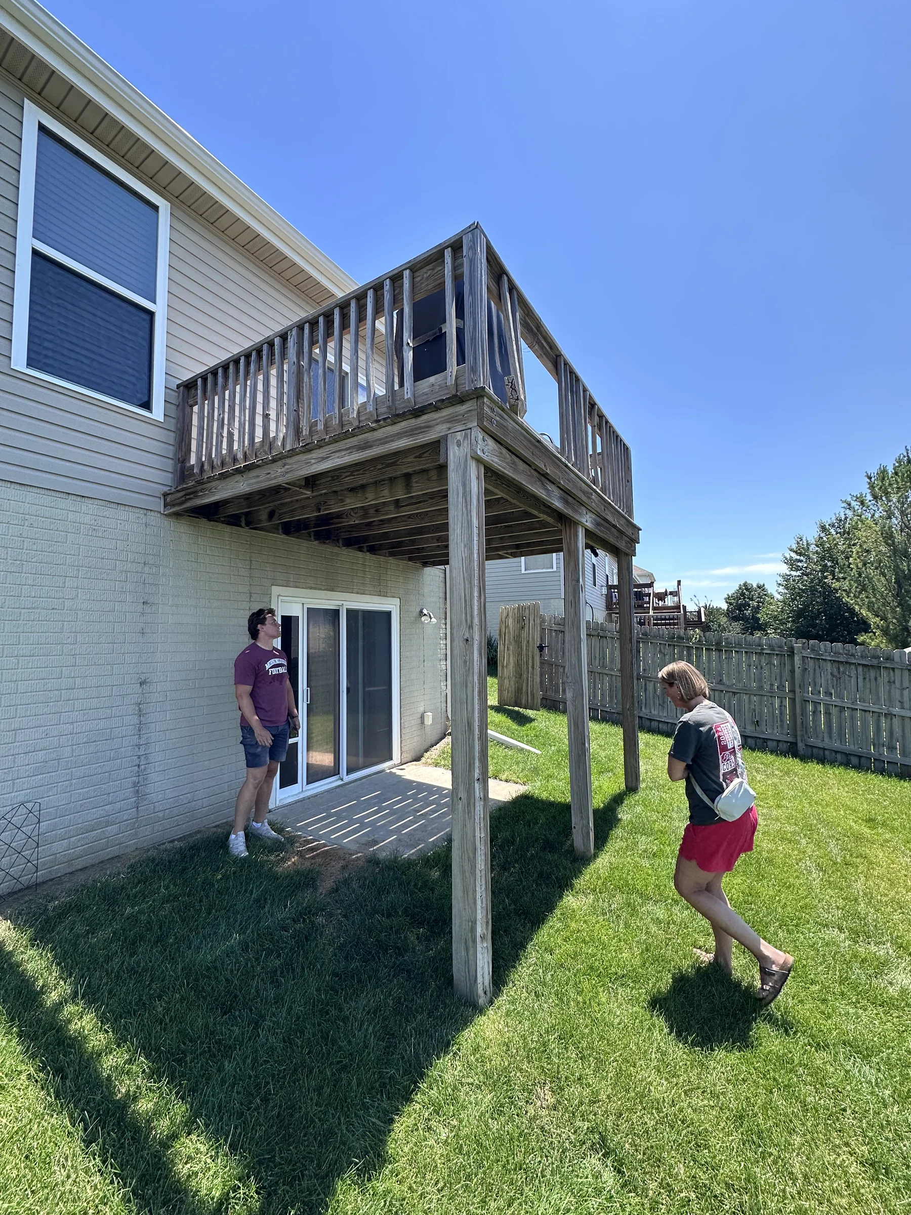 Old weathered second-story deck before rebuild
